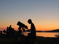 Visitors setting up telescopes for a star party at Rooster Rock