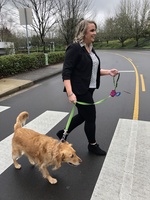 PGE Customer Service Center Manager Sarah Sims and Uma try out the Mohawk Street pedestrian crossing.