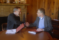Oregon State Forester Peter Daugherty (left) congratulates Court Stanley, President of Port Blakely's US Forestry Division, after the signing of a stewardship agreement Feb. 21 with the Oregon Department of Forestry. In the agreement, Port Blakely agrees 