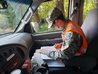 Cadet 1st Lt. Joshua Vanrenterghem, part of a ground team taking photographs not easily captured by aircrews, keeps a detailed log of his three-member team's mission.