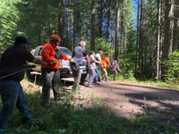 Searchers hoist Lawrence back to the roadway after he was located Monday morning.