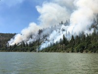 Land managers use controlled burns when weather conditions will carry smoke aloft and disperse it. Such burns remove woody fuels in hopes of reducing the risk of higher intensity wildfires, which produce much more smoke and often occur when air currents a