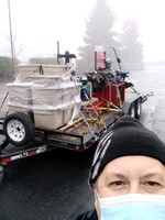 Clackamas Community College automotive instructor Jay Leuck picks up a load of equipment and tools donated to the college from the World of Speed.