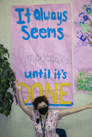 Prairie High School senior Hannah Hollenbeak poses under a poster she made as part of Inspire Week at the school