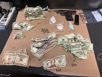 Gun, Drugs, Cash Seized