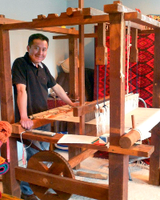 Franciso Bautista stands at his loom