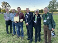 David Bugni (center holding plaques) and his wife, Mary Ann (not pictured), are Oregon's new Tree Farmer of the Year. Also pictured from left are Chad Davis (US Forest Service, Josh Barnard (Oregon Department of Forestry), Dick Courter, Wylda Cafferata an