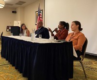 Oregon Housing and Community Services Director Andrea Bell (second from right) addresses the audience at the annual Oregon Mayors Association Conference at the Best Western Plus in Lincoln City on August 12, 2022. Other panelists included (from left) Nort