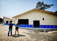 Jeff & Steve Bailey, stand in the construction site of the retail building located inside Umpqua Dunes County Park & Campground. 