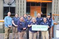 The Tillamook Forest Center staff celebrate after a soft opening March 10 for Oregon Department of Forestry staff and family members.  The center reopens to the public Saturday. (Oregon Department of Forestry photo)