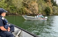 Image of OSP Trooper engaging with anglers