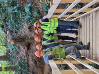 AICs standing on the completed Wilson River Trail bridge. Construction of the bridge took a total of 14 days to complete. 