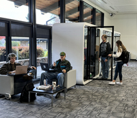 UCC students studying and meeting in a study pod.