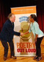 Then-Oregon Poet Laureate Kim Stafford congratulates 2019 Oregon champion Belise Nishimwe of St. Mary's Academy.