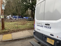 Police van in front of encampment