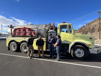 Bureau of Land Management employees transfer the pictured water tender to the Wheeler County Rangeland Fire Protection Association in 2022.